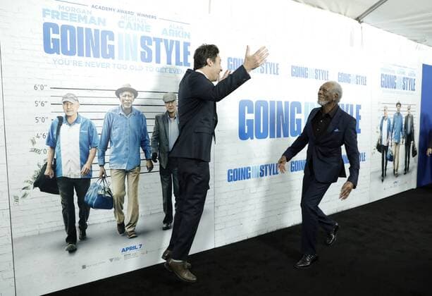 Morgan Freeman and Zach Braff leap at each other when they arrive on the red carpet at the Going in Style World Premiere at SVA Theatre on March 30, 2017 in New York City.  NYP20170330123 JOHNxANGELILLO