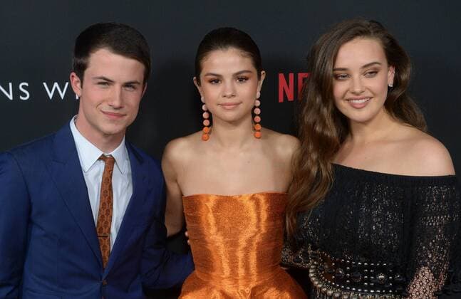 Executive producer and actress Selena Gomez (C) and cast members Dylan Minnette (L) and Katherine Langford attend the premiere of Netflix s 13 Reasons Why on the Paramount Pictures Studios lot in Los Angeles on March 30, 2017. Storyline: Follows teenager Clay Jensen, in his quest to uncover the story behind his classmate and crush, Hannah, and her decision to end her life.  LAP2017033012 JIMxRUYMEN