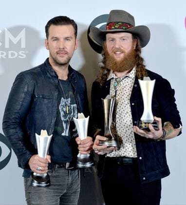 Musicians T.J. Osborne (L) and John Osborne of the music group Brothers Osborne, winners of the Vocal Duo of the Year award, appear backstage during the 52nd annual Academy of Country Music Awards held at T-Mobile Arena in Las Vegas, Nevada on April 2, 2017. The show will be telecast live on CBS.  LVP20170402223 JIMxRUYMEN