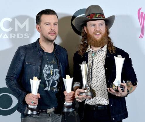 Musicians T.J. Osborne (L) and John Osborne of the music group Brothers Osborne, winners of the Vocal Duo of the Year award, appear backstage during the 52nd annual Academy of Country Music Awards held at T-Mobile Arena in Las Vegas, Nevada on April 2, 2017. The show will be telecast live on CBS.  LVP20170402224 JIMxRUYMEN