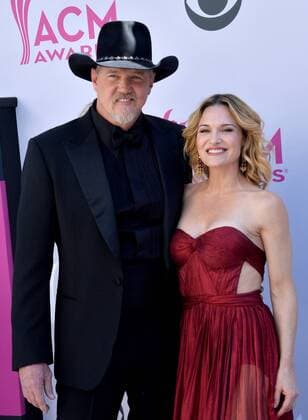 Singer Trace Adkins (L) and Victoria Pratt attend the 52nd annual Academy of Country Music Awards held at T-Mobile Arena in Las Vegas, Nevada on April 2, 2017. The show will be telecast live on CBS.  LVP20170402344 JIMxRUYMEN