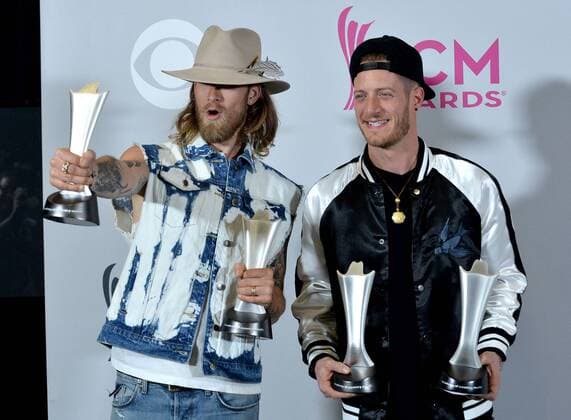 Musicians Tyler Hubbard (L) and Brian Kelley of the music group Florida Georgia Line, winners of the Vocal Event of the Year and Single Record of the Year awards appear backstage during the 52nd annual Academy of Country Music Awards held at T-Mobile Arena in Las Vegas, Nevada on April 2, 2017. The show will be telecast live on CBS.  LVP20170402334 JIMxRUYMEN