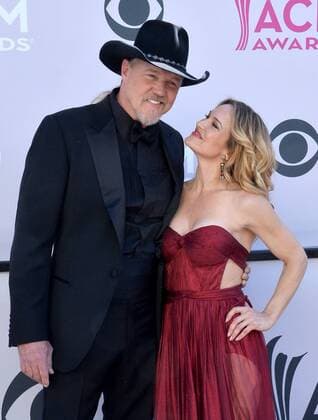 Singer Trace Adkins (L) and Victoria Pratt attend the 52nd annual Academy of Country Music Awards held at T-Mobile Arena in Las Vegas, Nevada on April 2, 2017. The show will be telecast live on CBS.  LVP20170402346 JIMxRUYMEN