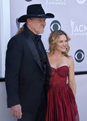 Singer Trace Adkins (L) and Victoria Pratt attend the 52nd annual Academy of Country Music Awards held at T-Mobile Arena in Las Vegas, Nevada on April 2, 2017. The show will be telecast live on CBS.  LVP20170402347 JIMxRUYMEN