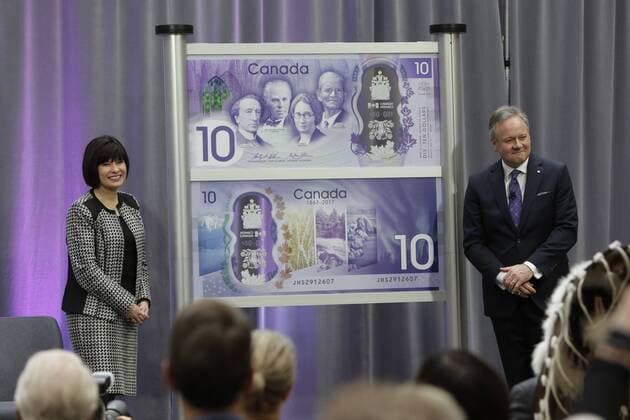 (170407) -- OTTAWA, April 7, 2017 -- Bank of Canada Governor Stephen Poloz (R) and Canadian parliamentary secretary to the minister of finance Ginette Petitpas Taylor unveil a 10-Canadian-dollar banknote in Ottawa, Canada, on April 7, 2017. The Bank of Canada on Friday unveiled a commemorative 10-Canadian-dollar banknote to mark the 150th anniversary of the country. ) CANADA-OTTAWA-COMMEMORATIVE BANKNOTE-UNVEILING DavidxKawai 