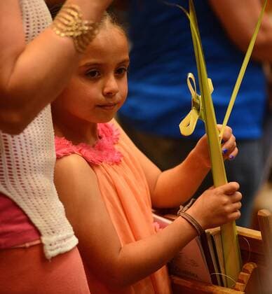 April 9, 2017 - Albuquerque, NEW MEXICO, U.S. - JOURNAL 040917.7 year-old Madyssen Macias,<cq>, holds her palms to be blessed during the 12:15 pm Mass at Our Lady of the Most Holy Rosary Catholic Church on Albuquerque West Mesa. Palm Sunday marks the beginning of Holy Week for Christians. Photographed on Sunday April 9, 2017. . JOURNAL. Albuquerque U.S. - ZUMAab1_ 20170409_zaf_ab1_006 Copyright: xAdolphexPierre-Louisx