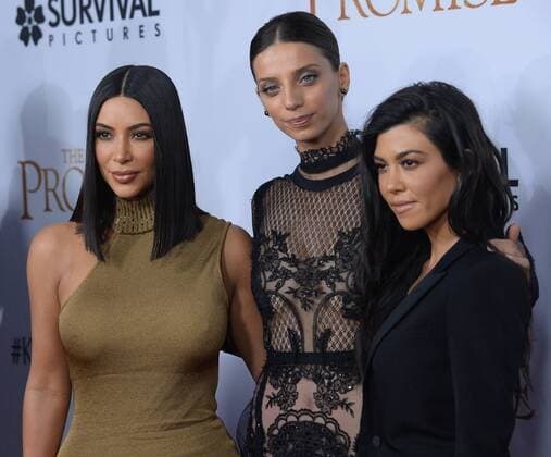 TV personalities Kim Kardashian West (L) and Kourtney Kardashian (R) and cast member Angela Sarafyan (C) attend the premiere of the motion picture historical drama The Promise at TCL Chinese Theatre in the Hollywood section of Los Angeles on April 12, 2017. Storyline: Set during the last days of the Ottoman Empire, The film follows a love triangle between Michael, a brilliant medical student, the beautiful and sophisticated Ana, and Chris - a renowned American journalist based in Paris.  LAP2017041218 JIMxRUYMEN