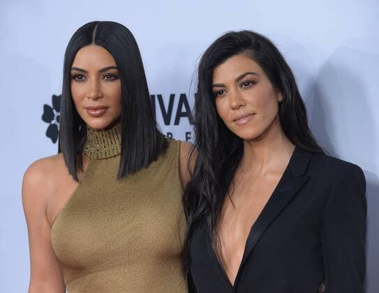 TV personalities Kim Kardashian West (L) and Kourtney Kardashian attend the premiere of the motion picture historical drama The Promise at TCL Chinese Theatre in the Hollywood section of Los Angeles on April 12, 2017. Storyline: Set during the last days of the Ottoman Empire, The film follows a love triangle between Michael, a brilliant medical student, the beautiful and sophisticated Ana, and Chris - a renowned American journalist based in Paris.  LAP2017041220 JIMxRUYMEN