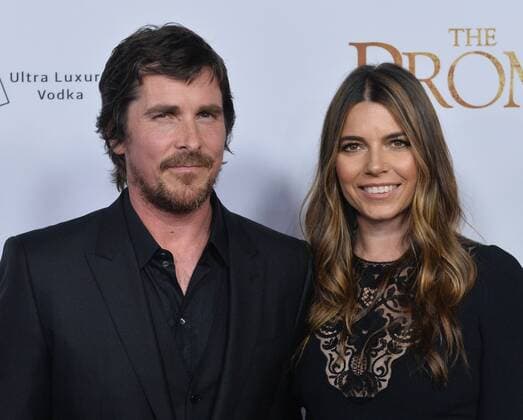 Cast member Christian Bale (L) and his wife Sibi Blazic attend the premiere of the motion picture historical drama The Promise at TCL Chinese Theatre in the Hollywood section of Los Angeles on April 12, 2017. Storyline: Set during the last days of the Ottoman Empire, The film follows a love triangle between Michael, a brilliant medical student, the beautiful and sophisticated Ana, and Chris - a renowned American journalist based in Paris.  LAP2017041202 JIMxRUYMEN