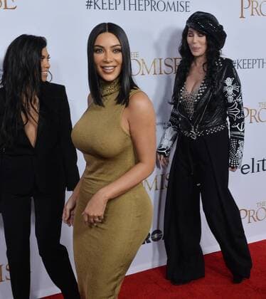 TV personalities Kourtney Kardashian (L) and Kim Kardashian West (C) and actress singer Cher attend the premiere of the motion picture historical drama The Promise at TCL Chinese Theatre in the Hollywood section of Los Angeles on April 12, 2017. Storyline: Set during the last days of the Ottoman Empire, The film follows a love triangle between Michael, a brilliant medical student, the beautiful and sophisticated Ana, and Chris - a renowned American journalist based in Paris.  LAP2017041205 JIMxRUYMEN
