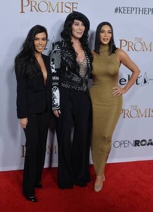 TV personalities Kourtney Kardashian (L) and Kim Kardashian West (R) and actress singer Cher attend the premiere of the motion picture historical drama The Promise at TCL Chinese Theatre in the Hollywood section of Los Angeles on April 12, 2017. Storyline: Set during the last days of the Ottoman Empire, The film follows a love triangle between Michael, a brilliant medical student, the beautiful and sophisticated Ana, and Chris - a renowned American journalist based in Paris.  LAP2017041231 JIMxRUYMEN