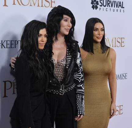 TV personalities Kourtney Kardashian (L) and Kim Kardashian West (R) and actress singer Cher attend the premiere of the motion picture historical drama The Promise at TCL Chinese Theatre in the Hollywood section of Los Angeles on April 12, 2017. Storyline: Set during the last days of the Ottoman Empire, The film follows a love triangle between Michael, a brilliant medical student, the beautiful and sophisticated Ana, and Chris - a renowned American journalist based in Paris.  LAP2017041232 JIMxRUYMEN