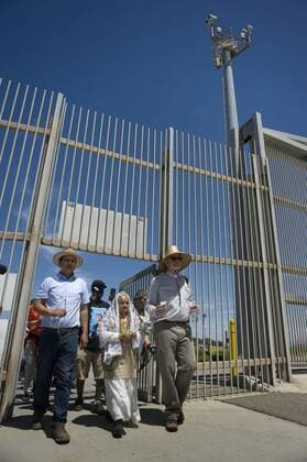 Members of a group called the Caravan Against Fear, walk through a secondary border fence toward the U.S.-Mexico border wall during a visit to Friendship Park on April 16, 2017, in San Diego, California, USA. The caravan of about 60 people, which was calling attention to immigrant rights issues, began six days ago in Sacramento, California, and visited the border where families visit through the border fence. CARAVANA TOURS BORDER BETWEEN US AND MEXICO TO CALL ATTENTION ON IMMIGRANT RIGHTS !ACHTUNG: NUR REDAKTIONELLE NUTZUNG!  Copyright: xDavidxMaungx SAN01 20170417-636279898799520147