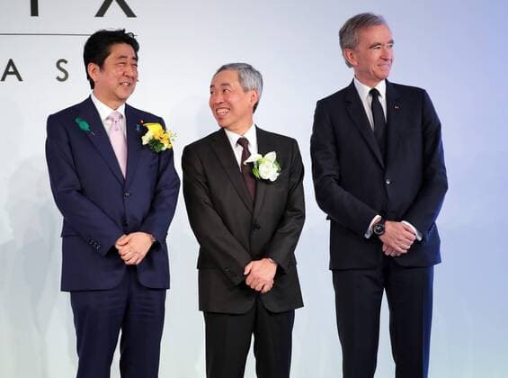 April 17, 2017, Tokyo, Japan - Japanese Prime Minister Shinzo Abe (L) smiles with Mori Building president Shingo Tsuji (C) and LVMH group CEO Bernard Arnault (R) at the opening ceremony of Tokyo s new landmark Ginza Six in Tokyo s Ginza fashion district on Monday, April 17, 2017. The new office and shopping mall complex which has 420 fashion brand shops will open on April 20.  (lwxa009878)
