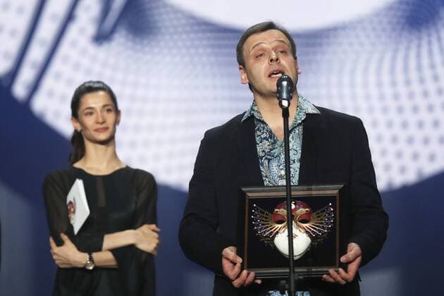 MOSCOW, RUSSIA - APRIL 19, 2017: Russian conductor Pavel Klinichev (R) accepts an award for Ballet Best Conductor for Ondine, Bolshoi Theatre, Moscow, at the 2017 Golden Mask award ceremony at the Stanislavsky and Nemirovich-Danchenko Moscow Music Theatre. Valery Sharifulin TASS  TS048DE5