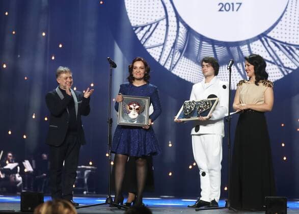 MOSCOW, RUSSIA - APRIL 19, 2017: Russian soprano Nadezhda Pavlova (2nd L) accepts an award for Opera Best Actress for La Traviata, Opera and Ballet Theatre, Perm, from Russian stage director and choreographer Mikhail Kislyarov (L) at the 2017 Golden Mask award ceremony at the Stanislavsky and Nemirovich-Danchenko Moscow Music Theatre. Valery Sharifulin TASS  TS048DF0