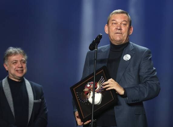 MOSCOW, RUSSIA - APRIL 19, 2017: Bolshoi Theatre Director Vladimir Urin (R) accepts an award for Opera Best Production for Rodelinda from Russian stage director and choreographer Mikhail Kislyarov at the 2017 Golden Mask award ceremony at the Stanislavsky and Nemirovich-Danchenko Moscow Music Theatre. Valery Sharifulin TASS  TS048E08
