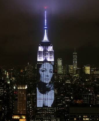 An artist rendering image of Elizabeth Taylor is projected onto the Empire State Building in the Manhattan skyline to celebrate Harper Bazaar s 150th anniversary on April 19, 2017 in New York City. Spanning 42 floors of the building and rising 500 feet high, the show featured iconic fashion images of everyone from Audrey Hepburn to Kate Moss, including iconic works by the likes of Andy Warhol.  NYP201704191299 JOHNxANGELILLO