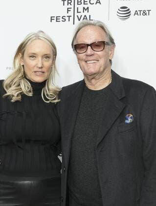 US: 2017 Tribeca film festival opening night Margaret DeVogelaere, Peter Fonda attend movie Clive Davis: The Soundtrack Of Our Lives Premiere at Radio City Music Hall during Tribeca Film Festival opening night  LevxRadin