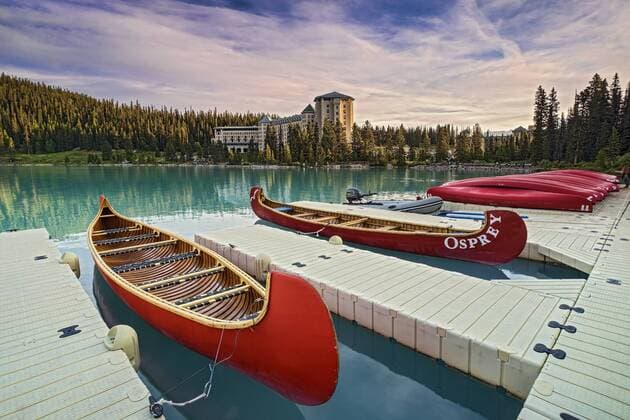 Red canoes in front of the Chateau Lake Louise hotel in the Canadian Rockies. Copyright: xAlanxNovelli LOOPxIMAGESx ANI22316WT32