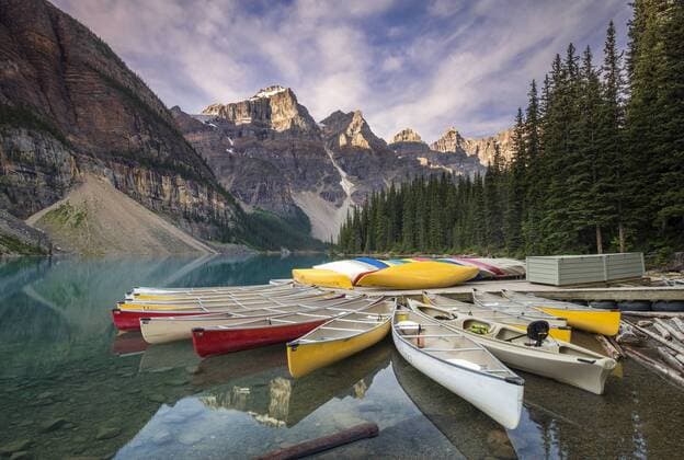 Multicoloured canoes on Moraine Lake in the valley of the ten peaks. Copyright: xAlanxNovelli LOOPxIMAGESx ANI22316WT37