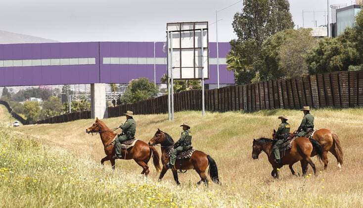 April 21, 2017 - San Ysidro, California, U.S.- The San Diego Sector Customs and Border Protection horse patrol rode along the border with Mexico before a press conference featuring attorney general Jeff Sessions and Homeland Security Secretary John Kelly. At rigth in brown is the old border fence. In purple at top of photo is the Cross Border Xpress, a pathway for those in the United States to cross over, take and return from flights in Mexico at Tijuana s Rodriguez airport. San Ysidro U.S. - ZUMAga3_ 20170421_zap_ga3_012 Copyright: xJohnxGastaldox
