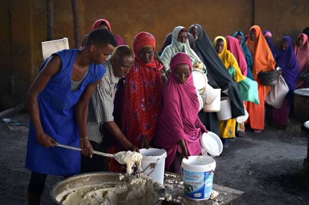 March 9, 2017 - Mogadishu, Somalia - Somalia women line up for porridge at a feeding centre March 9, 2017 in Mogadishu, Somalia. Somalia is experiencing a severe drought, and may be on the brink of famine unless urgent humanitarian action is taken soon. Mogadishu Somalia - ZUMAp138 20170309_zaa_p138_026 Copyright: xTobinxJonesx