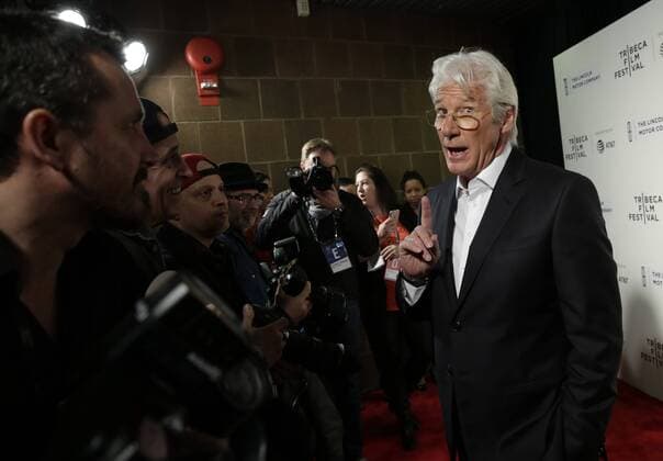 Richard Gere speaks to photographers when he arrives on the red carpet at The Dinner Premiere at BMCC Tribeca PAC on April 24, 2017 in New York City.  NYP20170424155 JOHNxANGELILLO