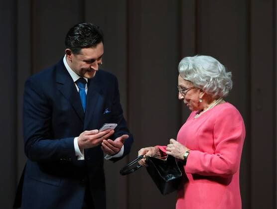 MOSCOW, RUSSIA - APRIL 24, 2017: Actor Oleg Maslennikov-Voitov (L) as David Cameron and actress Inna Churikova as Queen Elizabeth II in a scene during a pre-premiere of Peter Morgan s play The Audience staged by Gleb Panfilov at the Theatre of Nations. The play tells about Queen Elizabeth II s weekly meetings with prime ministers. Valery Sharifulin TASS  TS049792