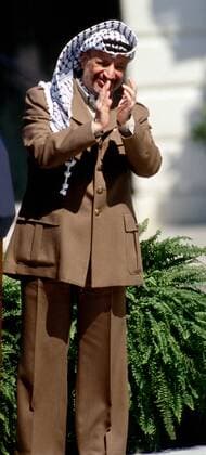 September 13, 1993 - Washington, District of Columbia, U.S - Palestine Liberation Organization Chairman Yasser Arafat applauds the signing of the Israeli-Palestinian Declaration of Principles peace accords at a White House South Lawn ceremony, Washington, DC., September 13, 1993. Washington U.S. - ZUMAr142 19930913_zap_r142_007 Copyright: xMarkxReinsteinx