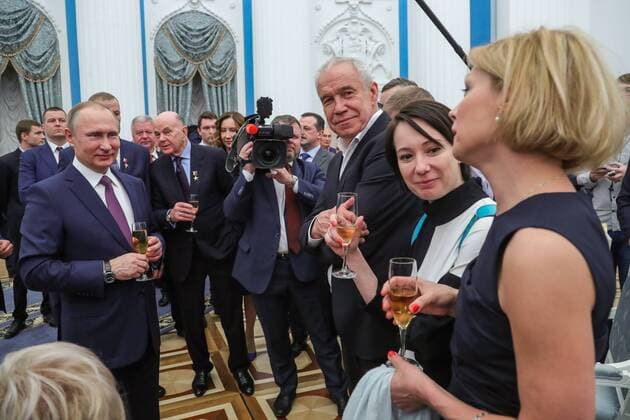 MOSCOW, RUSSIA - APRIL 28, 2017: Russia s President Vladimir Putin, actors Sergei Garmash, Chulpan Khamatova, and Alyona Babenko (L-R) drink champagne after an award ceremony to present the Hero of Labour of the Russian Federation medals at Moscow s Kremlin. The Hero of Labour of the Russian Federation title is bestowed on Russian citizens for their contribution to Russia s society, economy, culture, education, industry, and agriculture. Mikhail Klimentyev Russian Presidential Press and Information Office TASS TS04A01B