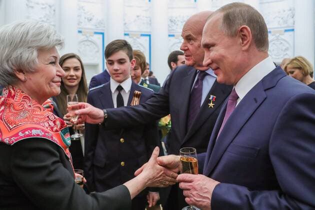 MOSCOW, RUSSIA - APRIL 28, 2017: Russia s President Vladimir Putin, chief physician of the Ochapovsky Regional Clinical Hospital No 1 (Krasnodar Territory), Vladimir Porkhanov (R-L), drink champagne after an award ceremony to present the Hero of Labour of the Russian Federation medals at Moscow s Kremlin. The Hero of Labour of the Russian Federation title is bestowed on Russian citizens for their contribution to Russia s society, economy, culture, education, industry, and agriculture. Mikhail Klimentyev Russian Presidential Press and Information Office TASS TS04A01F