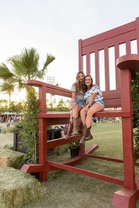 April 28, 2017 - Indio, California, U.S - Female fans sit in the giant rocking chair during Stagecoach Music Festival in Indio, California Indio U.S. - ZUMAs135 20170428_zap_s135_088 Copyright: xDanielxDeSloverx