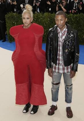 Helen Lasichanh and Pharrell Williams arrives on the red carpet at the Costume Institute Benefit at The Metropolitan Museum of Art celebrating the opening of Rei Kawakubo Comme des Garcons: Art of the In-Between in New York City on May 1, 2017.  NYP20170501109 JOHNxANGELILLO