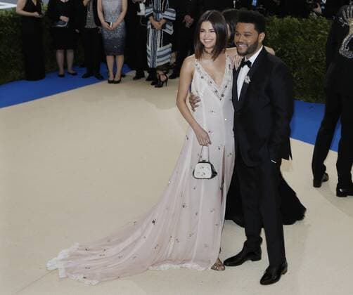 Selena Gomez and The Weeknd arrive on the red carpet at the Costume Institute Benefit at The Metropolitan Museum of Art celebrating the opening of Rei Kawakubo Comme des Garcons: Art of the In-Between in New York City on May 1, 2017.  NYP20170501168 JOHNxANGELILLO