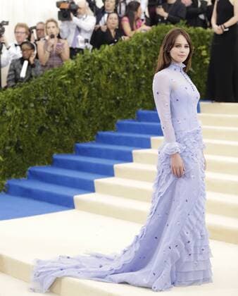 Felicity Jones arrives on the red carpet at the Costume Institute Benefit at The Metropolitan Museum of Art celebrating the opening of Rei Kawakubo Comme des Garcons: Art of the In-Between in New York City on May 1, 2017.  NYP20170501588 JOHNxANGELILLO