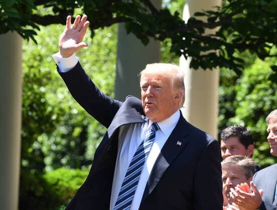 U.S. President Donald Trump waves after he awarded the Commander-In-Chief Trophy to the U.S. Air Force Academy during ceremony event in the Rose Garden of the White House in Washington, DC on May 2, 2017. The trophy is given annually to the winner of the Army, Navy and Air Force football rivalry.  WAP20170502101 PATxBENIC