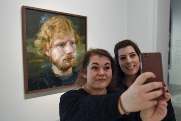 May 3, 2017 - London, UK - London, UK. (L to R) Martina Deligia and Ilenia Motta, Ed Sheeran fans from Italy, visit the National Portrait Gallery to take a selfie with a newly acquired portrait of the popular singer-songwriter Ed Sheeran, by artist Colin Davidson. The 4ft x 4ft painting oil painting is the first portrait painted of the singer since the start of his professional career and has just been put on public display. London UK  - ZUMAl94_ 20170503_zaf_l94_057 Copyright: xStephenxChungx