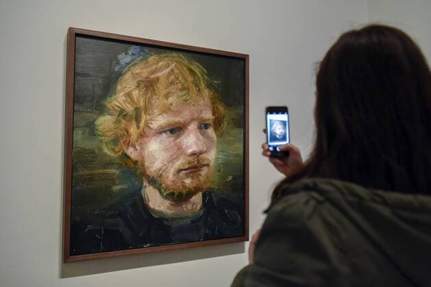 May 3, 2017 - London, UK - London, UK. A visitor to the National Portrait Gallery photographs a newly acquired portrait of the popular singer-songwriter Ed Sheeran, by artist Colin Davidson. The 4ft x 4ft painting oil painting is the first portrait painted of the singer since the start of his professional career and has just been put on public display. London UK  - ZUMAl94_ 20170503_zaf_l94_059 Copyright: xStephenxChungx