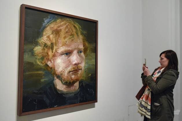 May 3, 2017 - London, UK - London, UK. A visitor to the National Portrait Gallery photographs a newly acquired portrait of the popular singer-songwriter Ed Sheeran, by artist Colin Davidson. The 4ft x 4ft painting oil painting is the first portrait painted of the singer since the start of his professional career and has just been put on public display. London UK  - ZUMAl94_ 20170503_zaf_l94_060 Copyright: xStephenxChungx