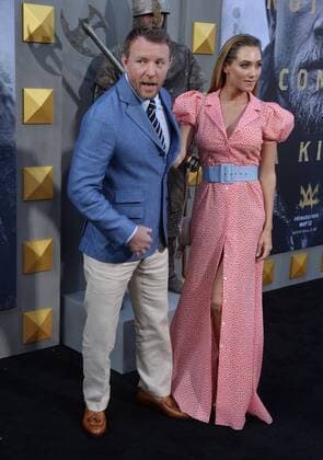 Director and writer Guy Ritchie and his wife, English model Jacqui Ainsley attend the premiere of his new motion picture fantasy King Arthur: Legend of the Sword at TCL Chinese Theatre in the Hollywood section of Los Angeles on May 8, 2017. Storyline: Robbed of his birthright, Arthur comes up the hard way in the back alleys of the city. But once he pulls the sword from the stone, he is forced to acknowledge his true legacy - whether he likes it or not.  LAP20170508904 JIMxRUYMEN