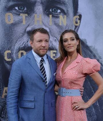 Director and writer Guy Ritchie and his wife, English model Jacqui Ainsley attend the premiere of his new motion picture fantasy King Arthur: Legend of the Sword at TCL Chinese Theatre in the Hollywood section of Los Angeles on May 8, 2017. Storyline: Robbed of his birthright, Arthur comes up the hard way in the back alleys of the city. But once he pulls the sword from the stone, he is forced to acknowledge his true legacy - whether he likes it or not.  LAP20170508905 JIMxRUYMEN