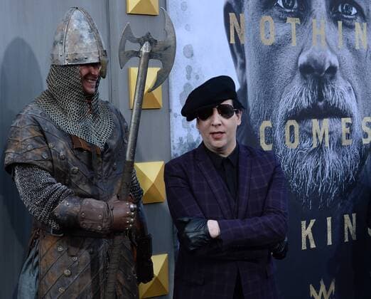 Musician Marilyn Manson attends the premiere of the motion picture fantasy King Arthur: Legend of the Sword at TCL Chinese Theatre in the Hollywood section of Los Angeles on May 8, 2017. Storyline: Robbed of his birthright, Arthur comes up the hard way in the back alleys of the city. But once he pulls the sword from the stone, he is forced to acknowledge his true legacy - whether he likes it or not.  LAP20170508926 JIMxRUYMEN