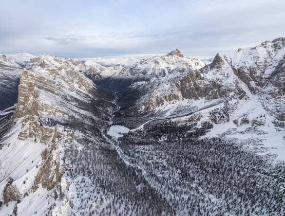 Aerial view of rocky peaks of Val Padeon and snowy woods, Cortina d Ampezzo, Province of Belluno, Dolomites, Veneto, Italy, Europe Copyright: RobertoxMoiola 1179-1873