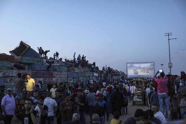 (170513) -- GAZA, May 13, 2017 -- Palestinians see a film during the opening ceremony of the Red Carpet Festival in Gaza City, on May 12, 2017. The Red Carpet is a festival for short and long narrative and documentary films. ) (gj) MIDEAST-GAZA-FILM FESTIVAL WissamxNassar 