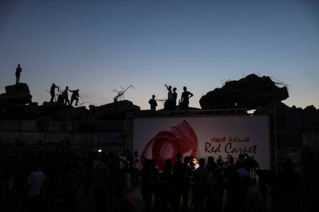 (170513) -- GAZA, May 13, 2017 -- Palestinians attend the opening ceremony of the Red Carpet Festival in Gaza City, on May 12, 2017. The Red Carpet is a festival for short and long narrative and documentary films. ) (gj) MIDEAST-GAZA-FILM FESTIVAL WissamxNassar 