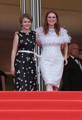 Millicent Simmonds (L) and Julianne Moore exit the Palais des Festivals after the screening of the film Wonderstruck during the 70th annual Cannes International Film Festival in Cannes, France on May 18, 2017.  CAN20170518063 DAVIDxSILPA