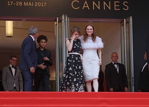 Millicent Simmonds (L) and Julianne Moore exit the Palais des Festivals after the screening of the film Wonderstruck during the 70th annual Cannes International Film Festival in Cannes, France on May 18, 2017.  CAN20170518064 DAVIDxSILPA