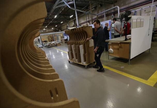 ST PETERSBURG, RUSSIA - MAY 19, 2017: Workers seen at a production workshop of a plant of the Pervaya Mebelnaya Fabrika First Furniture Factory after renovation. The renovation process started in 2014 as part of a joint investment project with the ALNO company (Germany). Peter Kovalev TASS  TS04F4AF