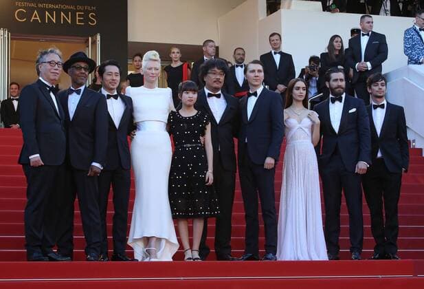 (From L to R) Byung Heebong, Giancarlo Esposito, Steven Yeun, Tilda Swinton, Ahn Seo-Hyun, Bong Joon-Ho, Paul Dano, Lily Collins, Jake Gyllenhaal and Devon Bostic arrive on the red carpet before the screening of the film Okja during the 70th annual Cannes International Film Festival in Cannes, France on May 19, 2017. CAN20170519107 DAVIDxSILPA